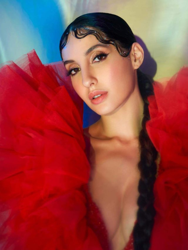 cropped-Nora-in-red-1.jpg