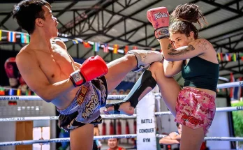 Forget passive beach holidays. A growing number of travelers are discovering that the ultimate wellness escape involves gloves, shin guards, and the ancient art of eight limbs. Muay Thai in Thailand has evolved from a spectator sport into a powerful vehicle for complete physical and mental renewal—especially on the island of Phuket, where world-class facilities meet tropical paradise. This isn't about fighting. It's about exercise that engages every muscle, health habits that stick, and a holiday that leaves you stronger than when you arrived. ________________________________________ Why Muay Thai Delivers Total Body Wellness Unlike repetitive gym routines, Muay Thai camp in Thailand is a full-system workout that challenges your cardiovascular system, core stability, and coordination simultaneously. A single hour involves shadow boxing, heavy bag work, pad drills with a trainer, and bodyweight conditioning—all while learning practical striking techniques. The health benefits are well-documented: • Fat burning: A typical session burns 600–1,000 calories • Cardiovascular fitness: Interval-based drilling mimics HIIT training • Bone density: Regular striking against pads strengthens wrists and shins • Stress relief: The focus required leaves no room for daily worries Many visitors arrive in Phuket feeling stiff, tired, or mentally foggy. After one week of morning sessions, they report better sleep, sharper focus, and a noticeable lift in mood. The combination of intense exercise and tropical surroundings creates a reset button for both body and spirit. Phuket: The Ideal Setting for a Wellness Holiday Phuket has become Southeast Asia's premier destination for combining Muay Thai with a genuine wellness retreat. The island offers dozens of reputable gyms—often called "camps" but more accurately described as training centers—that cater to absolute beginners and seasoned practitioners alike. What makes Phuket special is the ecosystem: • Nutrition support: Many facilities include healthy Thai meals (grilled chicken, papaya salad, coconut water) as part of the package • Recovery options: Traditional Thai massage, ice baths, and yoga are usually available on-site • Community atmosphere: You'll train alongside people from dozens of countries, creating instant camaraderie • Post-workout paradise: After morning training, you can rest on beaches like Kata or Nai Harn Unlike a standard holiday where you return home needing another vacation, a Muay Thai-focused trip leaves you fitter and more energized. One Australian visitor described it as "the first time I've ever lost weight on holiday without feeling deprived." Practical Advice for First-Time Visitors If you're considering Muay Thai in Thailand for your next wellness escape, here's how to make it work: Choose the right facility – Look for places that separate hobbyists from fighters. The best ones offer group classes focused on fitness alongside private technical sessions. Read recent reviews from visitors at your experience level. Suwit Muay Thai for improving overall conditioning is a Muay Thai camp for every levels. Start slowly – Even if you're generally fit, Muay Thai uses muscles differently. Begin with one session per day for the first few days, then add morning training if your body responds well. Prioritize recovery – Health comes from the rest as much as the work. Take advantage of Phuket's affordable Thai massage (300–500 baht per hour) and drink twice as much water as you think you need. Pack wisely – Bring hand wraps, a well-ventilated sports bra (or rash guard for men), and athletic tape for your toes. You can rent gloves and pads locally. Balance your holiday – A typical day might be: 7am training, 9am breakfast, 11am beach or pool, 2pm sightseeing, 4pm second session (optional), 7pm healthy dinner. This rhythm leaves plenty of time to explore Phuket's temples, viewpoints, and night markets. ________________________________________ In summary: A Muay Thai camp for holiday in Thailand offers something genuinely different—a chance to pursue wellness through purposeful exercise, surrounded by beautiful scenery and supportive people. Whether you stay for one week or one month, you'll return home not just rested, but transformed.